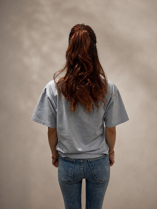 Back view of oversized Powder Blue hand-beaded JESUS t-shirt