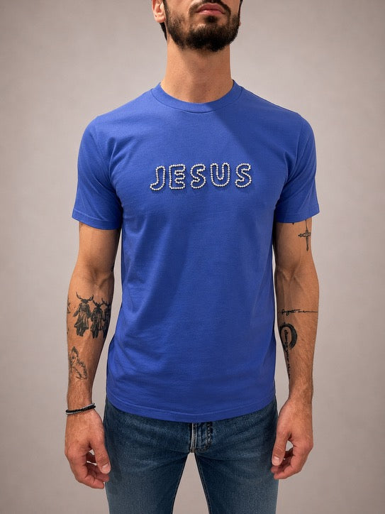 Close-up of Greek Blue JESUS t-shirt with hand-beaded silver bubble lettering