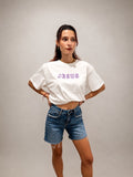 Woman wearing oversized White hand-beaded JESUS t-shirt, Christian and Orthodox tee, front view