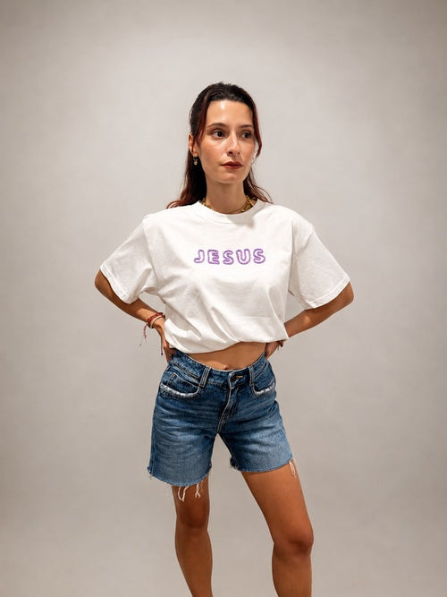Woman wearing oversized White hand-beaded JESUS t-shirt, Christian and Orthodox tee, front view