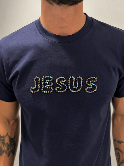 Close-up of Navy Blue JESUS t-shirt with hand-beaded multicolour and grey lettering