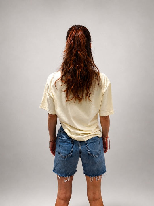 Back view of oversized Butter Yellow hand-beaded JESUS t-shirt
