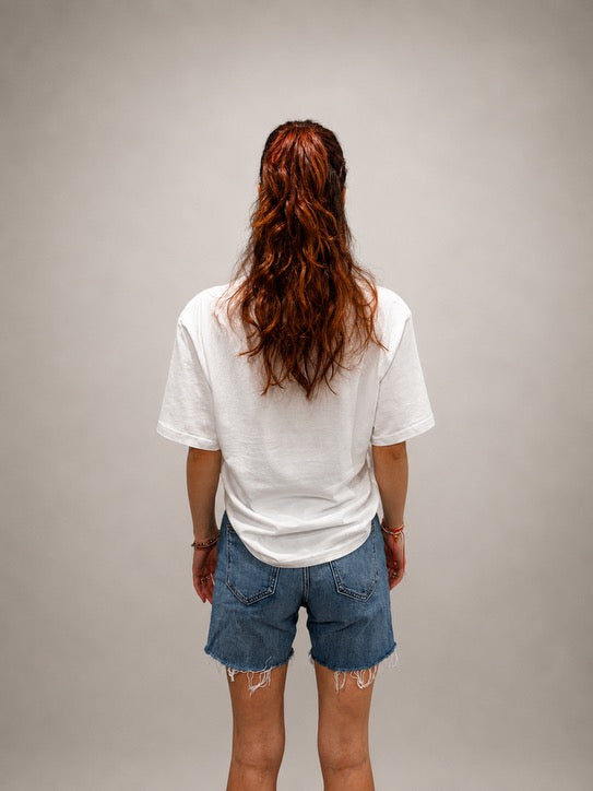 Back view of oversized White hand-beaded JESUS t-shirt